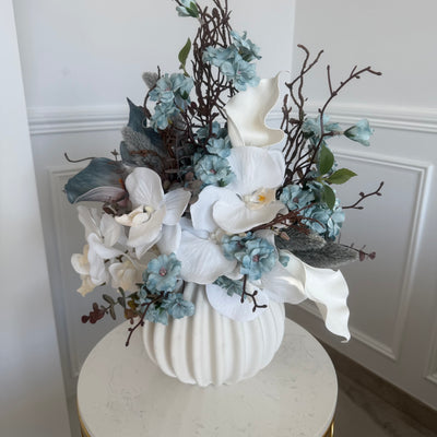 Iceblue blooms flower Arrangement