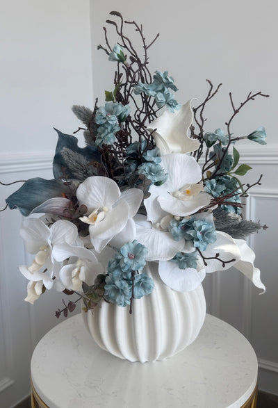 Iceblue blooms flower Arrangement