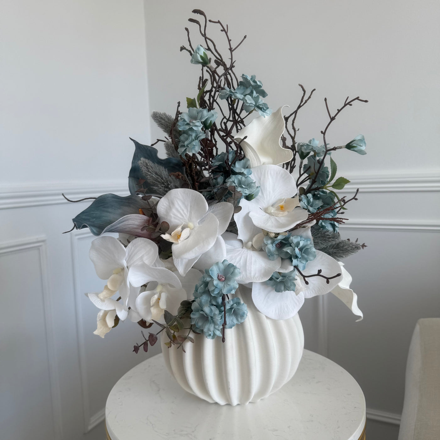 Iceblue blooms flower Arrangement