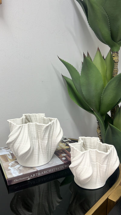 Swivel white ceramic vase