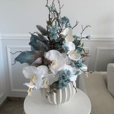 Iceblue blooms flower Arrangement